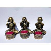 {
  "text": "Candle holder - Wise Buddhas"
}